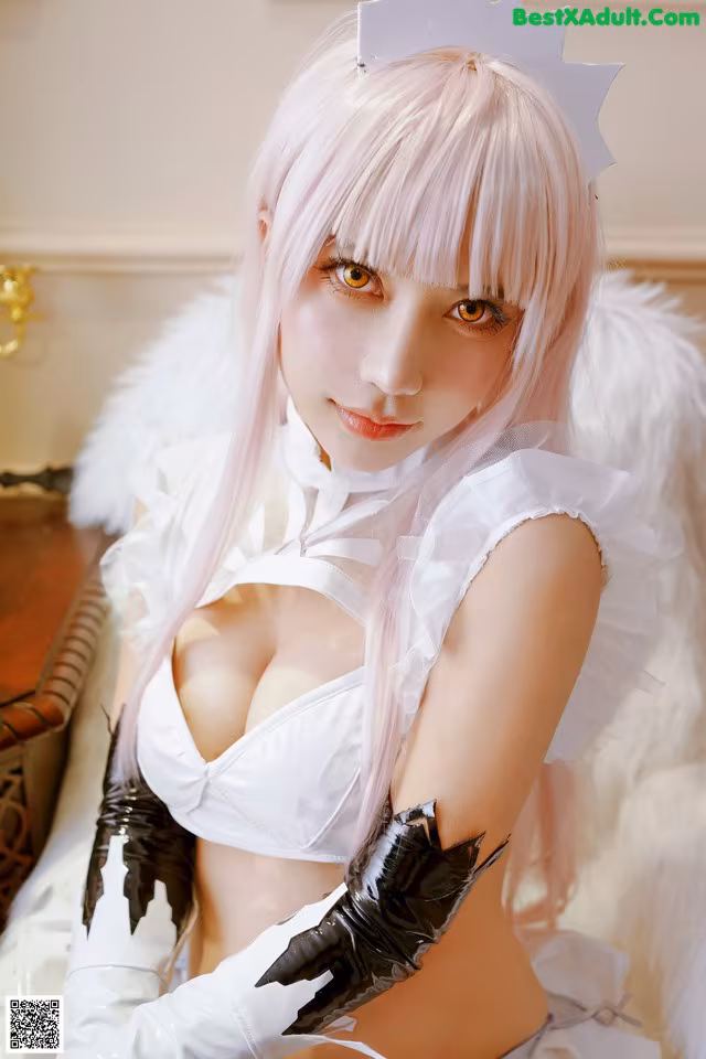 A woman with long pink hair wearing a white dress and gloves.
