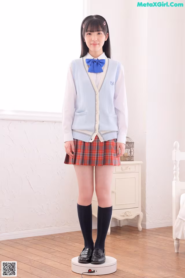 A woman in a school uniform standing on a scale.